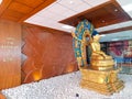 Beautiful golden statue of Gautam Buddah at the Tribhubon International airport in Kathmandu, Nepal presenting that Nepal is the Royalty Free Stock Photo