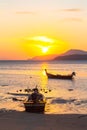 Beautiful golden sunrise above fishing boats in Rawai beach Royalty Free Stock Photo