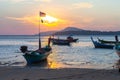 Beautiful golden sunrise above fishing boats in Rawai sea Royalty Free Stock Photo