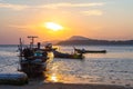 beautiful golden sunrise above fishing boats in Rawai beach Royalty Free Stock Photo