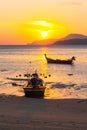 Beautiful golden sunrise above fishing boats in Rawai beach Royalty Free Stock Photo