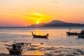 beautiful golden sunrise above fishing boats in Rawai beach Royalty Free Stock Photo