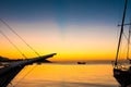 Beautiful golden sunset and blue sky over sea with boat in summer. Royalty Free Stock Photo