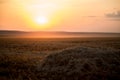 A beautiful Golden Sunset on a hay field Royalty Free Stock Photo