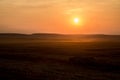 A beautiful Golden Sunset on a hay field