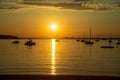 Beautiful golden sunset over the ocean and sailing boats. Royalty Free Stock Photo