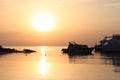 Beautiful golden sunset on the sea. Boats on the water. Warm rays of sun light. Red sea, Egypt Royalty Free Stock Photo