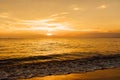 Beautiful golden sunset on sea shore. Landscape ocean waves at sunset Royalty Free Stock Photo