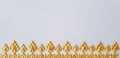 Beautiful golden Thai pattern style on a white wallpaper for background Royalty Free Stock Photo