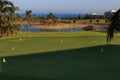 Golf course at the ocean side at sunset Royalty Free Stock Photo