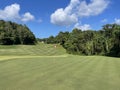 Beautiful Golf Hole, Green, Flag, Blue Sky Royalty Free Stock Photo