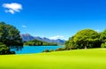 Beautiful golf park view next to beautiful mountains and lake Royalty Free Stock Photo