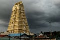 Beautiful gopuram of Chamundeshwari Temple against the sky with black clouds in Mysore, India