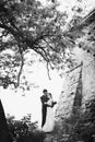 Beautiful gorgeous bride and groom kissing. happy wedding couple hugging and embracing at old castle. happy romantic moments. Royalty Free Stock Photo