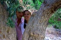 Beautiful gorgeous couple on the tree of love cedar, on cyprus