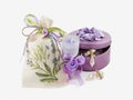 Beautiful gorgeous golden earings in violet gemstone box, aroma candle and linen stack