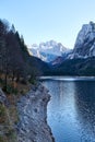 Beautiful Gosausee lake landscape with Dachstein mountains, forest, clouds and reflections in the water in Austrian Alps Royalty Free Stock Photo