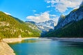 Beautiful Gosausee lake landscape with Dachstein mountains, forest, clouds and reflections in the water in Austrian Alps Royalty Free Stock Photo