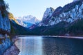 Beautiful Gosausee lake landscape with Dachstein mountains, forest, clouds and reflections in the water in Austrian Alps Royalty Free Stock Photo