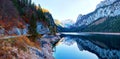 Beautiful Gosausee lake landscape with Dachstein mountains, forest, clouds and reflections in the water in Austrian Alps Royalty Free Stock Photo