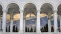 Beautiful gothic medieval arched stone window. Magnificent majestic view from the window. Winter mountains and a castle Royalty Free Stock Photo