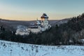 Beautiful gothic Royal Karlstejn Castle in winter with snow,Czech Republic.Founded by Charles IV.There are Czech crown jewels, Royalty Free Stock Photo