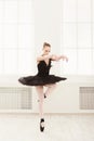 Beautiful graceful ballerina in black swan dress