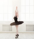 Beautiful graceful ballerina in black swan dress