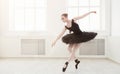 Beautiful graceful ballerina in black swan dress