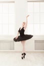 Beautiful graceful ballerina in black swan dress