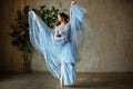 Beautiful graceful girl ballerina in blue dress dancing in point Royalty Free Stock Photo