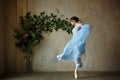 Beautiful graceful girl ballerina in blue dress dancing in point Royalty Free Stock Photo