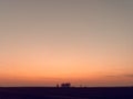 Beautiful gradient sky over a field at sunset