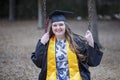 Beautiful Graduate Reminisces on the Playground of Her Elementary School