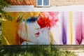 Beautiful graffiti on the wall depicting a portrait of a girl