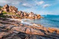 Beautiful Grand L Anse beach, La Digue, Seychelles. Tropical ocean coast, unique granite rocks and lonely sail boat on