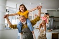 Grandchildren having fun at home while playing with their grandparents Royalty Free Stock Photo