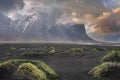 Beautiful grass on beach against Stokksnes cape and Vestrahorn Mountain at sunset