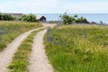 Beautiful gravel road to the coast in summer season