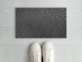 Beautiful Gray Solid Pebble Stone Sparkle Pattern entry designer doormat with white sneaker shoes