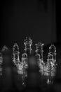 Beautiful grayscale closeup shot of clear glass chess pieces-perfect for mobile wallpapers