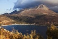 Beautiful greek landscape: seashore with mountains and clouds Royalty Free Stock Photo