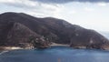 Beautiful greek landscape: seashore with mountains and clouds Royalty Free Stock Photo