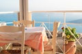 A beautiful Greek restaurant overlooking the blue ocean Royalty Free Stock Photo