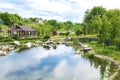 Beautiful green botanical landscape design in garden, city park with trees, bushes and benches, wooden gazebo Royalty Free Stock Photo