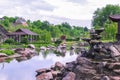 Beautiful green botanical landscape design in garden, city park with trees, bushes, wooden gazebo, decorative lake pond,fresh Royalty Free Stock Photo