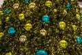 Beautiful green Christmas tree colorful Hanging decoration balls closeup Royalty Free Stock Photo