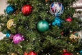 Beautiful green Christmas tree colorful Hanging decoration balls closeup Royalty Free Stock Photo