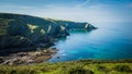 Beautiful green cliffs landscape by the blue Atlantic Ocean near Post Isaac in Cornwall, UK Royalty Free Stock Photo