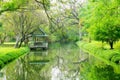 Beautiful green garden with canal and pavilion Royalty Free Stock Photo